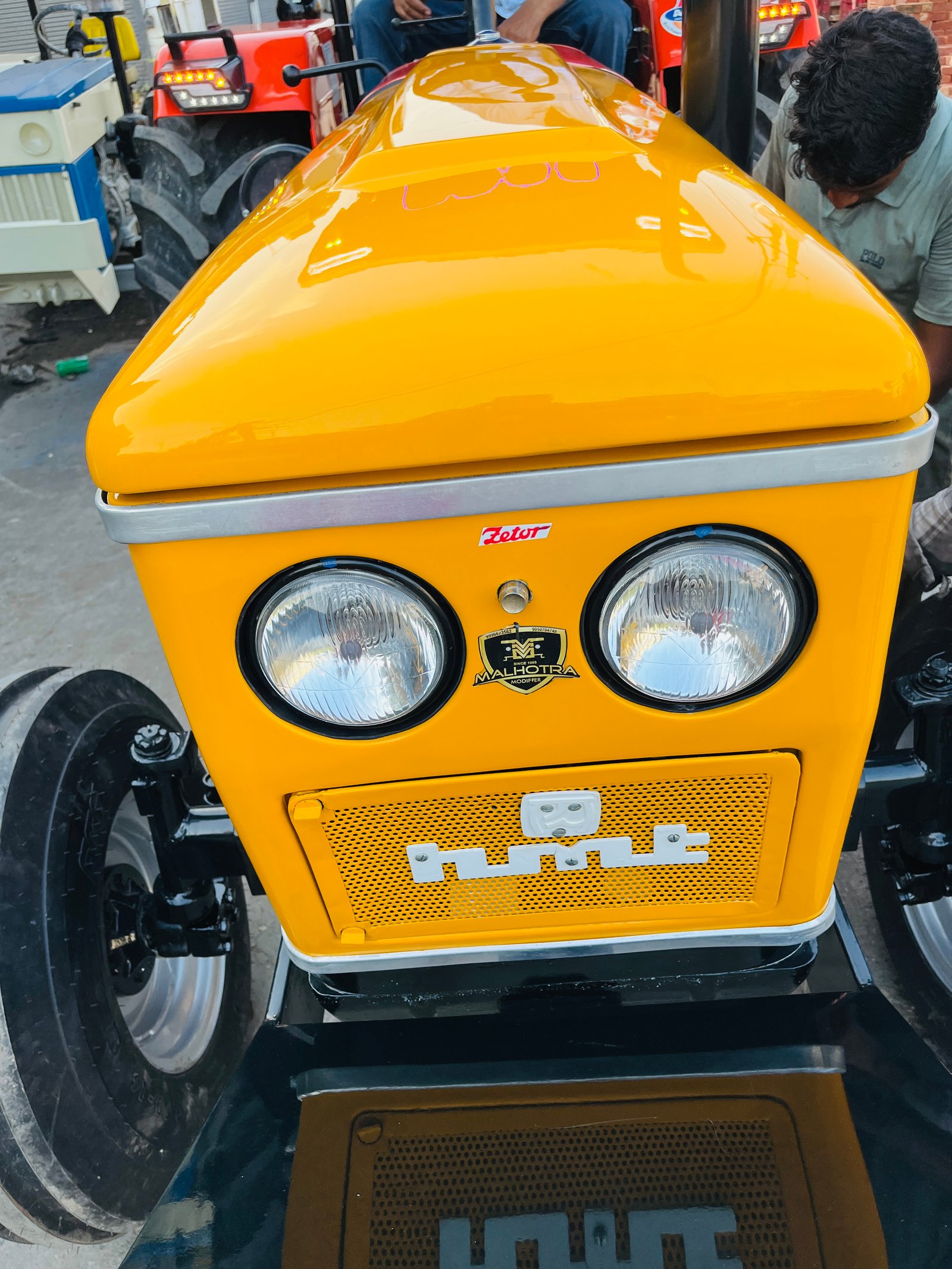 HMT 5911 restored tractor, yellow, front view with twin headlights