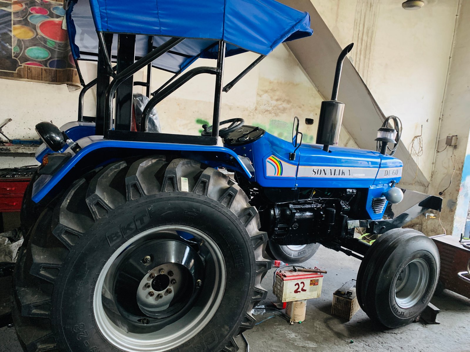 Sonalika DI-60 restored tractor, side view with canopy